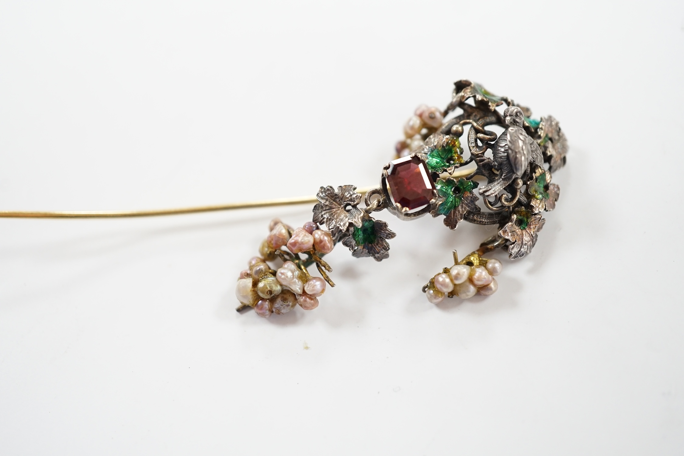 A 19th century Austro-Hungarian white metal garnet, enamel and seed baroque pearl set stick pin (adapted), 84mm.